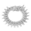 A silver spiked Cuban chain bracelet adorned with diamond accents.