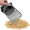 A hand is using a gray self-cleaning cat litter scoop with a mesh filter to scoop dry cat litter.