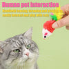 A hand is interacting with a plush mouse cat toy featuring a red body and yellow feather tail near a domestic cat.