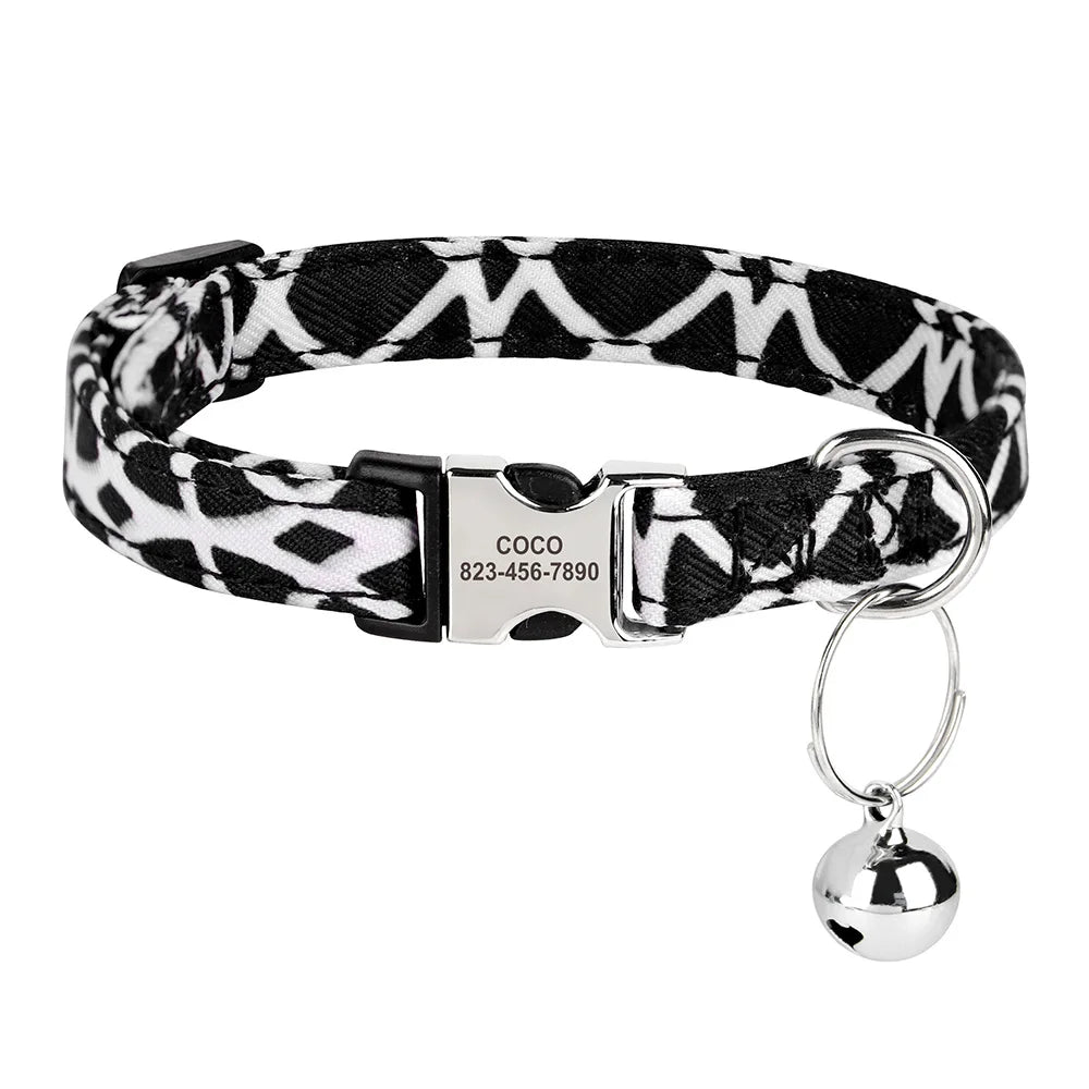 Black and white patterned collar with a silver buckle and attached engraved ID tag.
