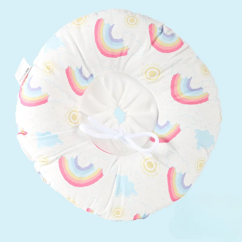 A white soft cotton recovery collar alternative for pets featuring colorful rainbow patterns.