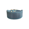 A dark gray genuine leather extra wide dog collar with brass hardware and blue stitching.