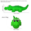 A bright green crocodile-shaped latex dog chew toy with a squeaker, shown in profile and front view.