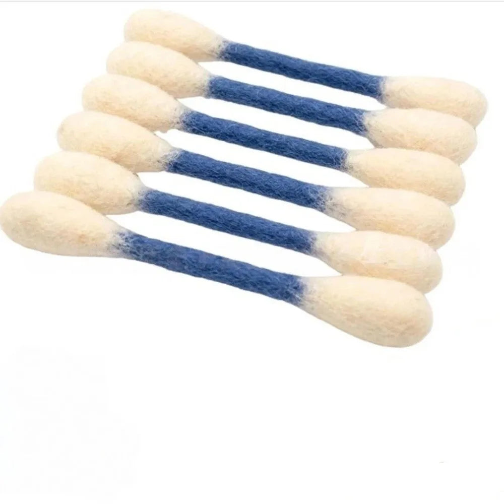 A set of oversized cotton swabs shaped like cat toys in light beige and blue colors.