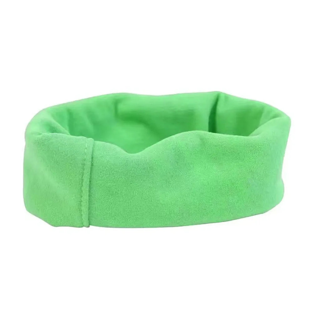 A bright green soundproof dog ear muff designed for comfort and noise reduction.