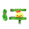 A bright yellow cartoon rabbit harness and leash set with green fabric straps.