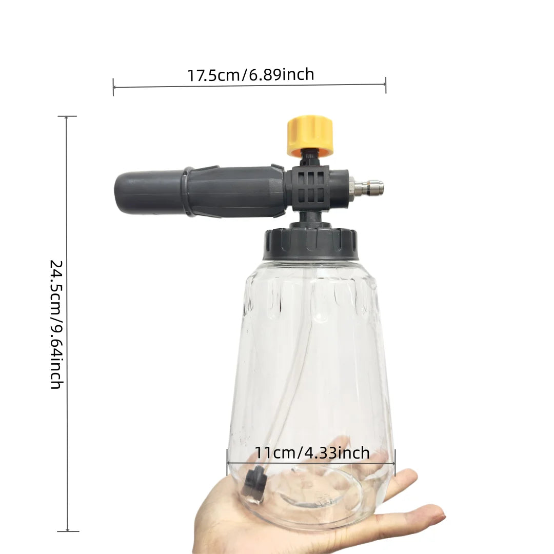 A clear plastic bottle with a black foam cannon and yellow nozzle is shown being held by a hand.