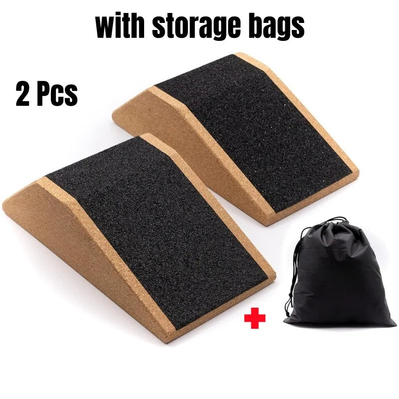 Two black anti-slip cork squat wedges with storage bags shown on a white background.