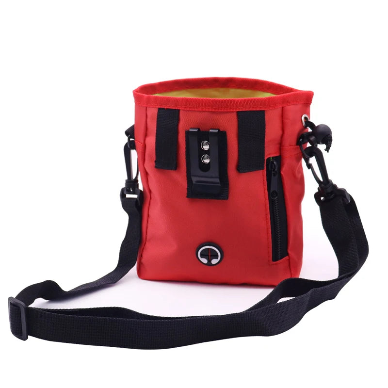 A red durable pet training treat bag with black accents and a black strap.