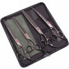 A black case holding a pair of professional stainless steel pet grooming scissors and a green cloth.