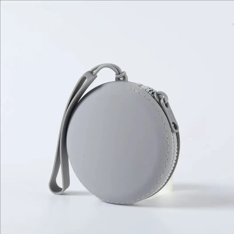 A gray silicone pet treat pouch with a strap, shown against a white background.
