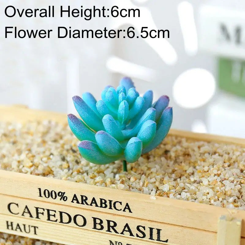 Blue artificial succulent plant in a wooden tray with light sand for desk decor