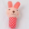 A pink bone-shaped plush dog toy with pink ears and a red polka-dot body.