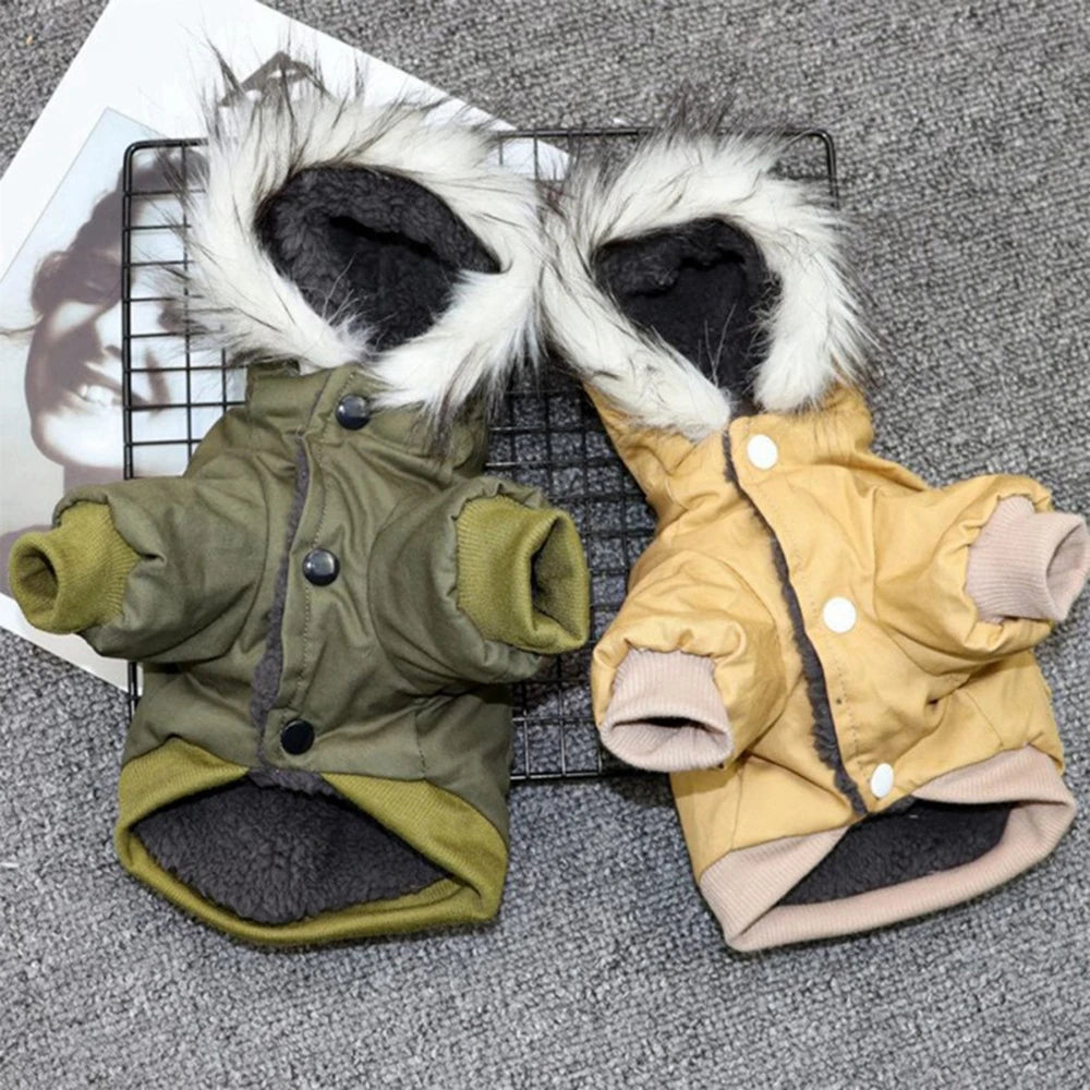 A pair of cozy hooded winter jackets for small dogs, one olive green and one tan, displayed on a black wire grid.