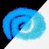 A close-up view of bright blue and cyan glow-in-the-dark decorative pebbles.
