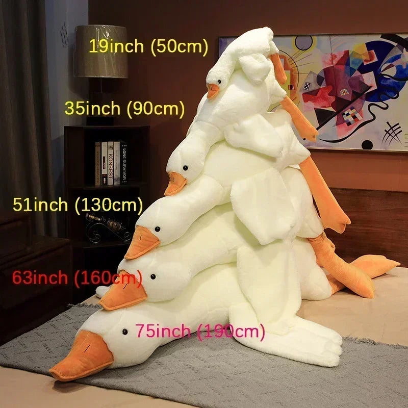 A large white plush goose body pillow with orange accents shown next to various size measurements.