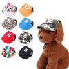 A collection of various pet grooming and fashion visor caps for dogs and cats in floral, solid colors, camouflage, and stripe