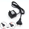 Black submersible aquarium water pump with a cord and various plug adapters for different regions.