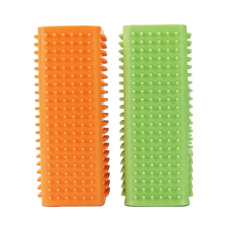 A pair of silicone pet hair remover brushes, one orange and one light green.
