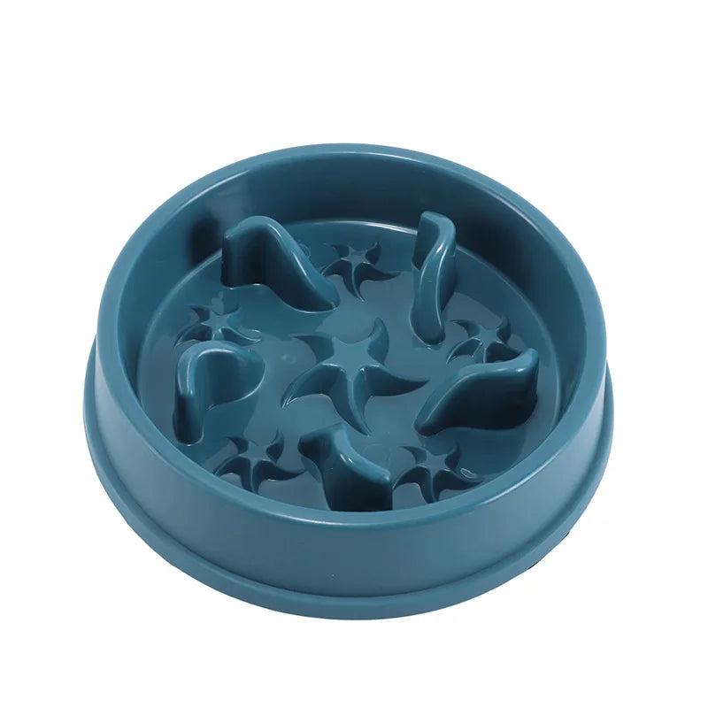 A teal anti-slip slow feeder bowl with star-shaped indentations for small pets.