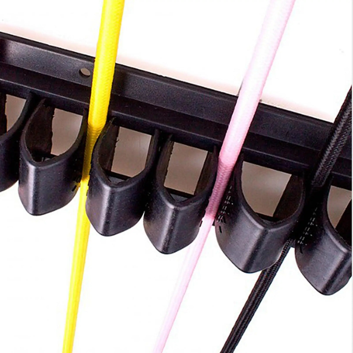 Wall-mounted whip organizer rack with black and pink colored silicone holders
