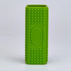A bright green silicone pet hair remover brush with a textured body and an oval indentation.
