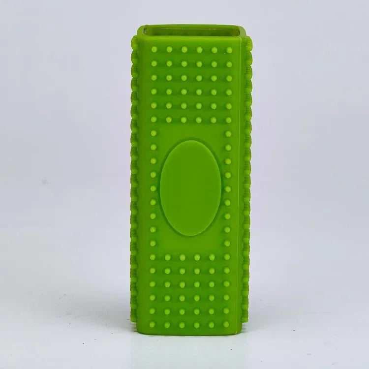 A bright green silicone pet hair remover brush with a textured body and an oval indentation.