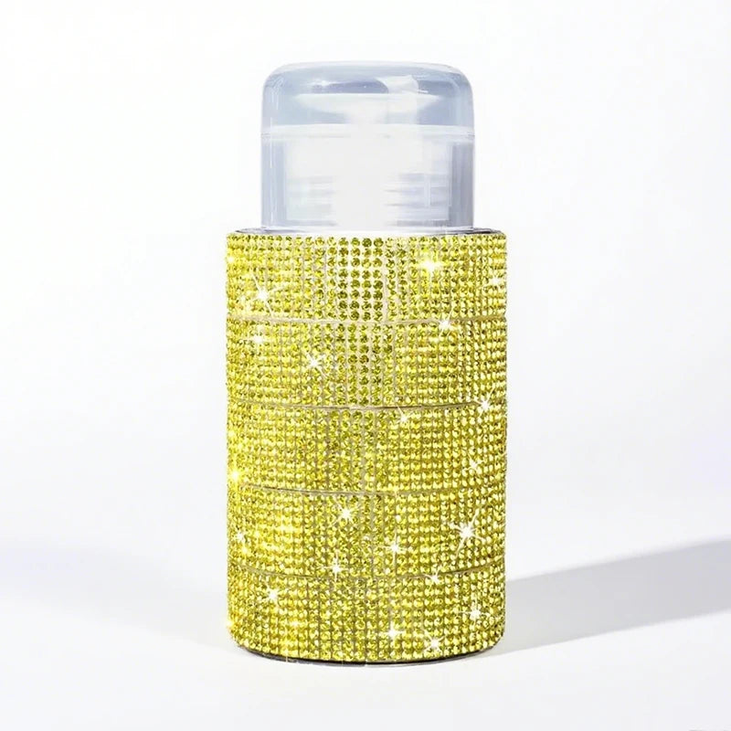 A refillable diamond design pump bottle for nail polish remover and makeup, featuring a gold glitter texture.