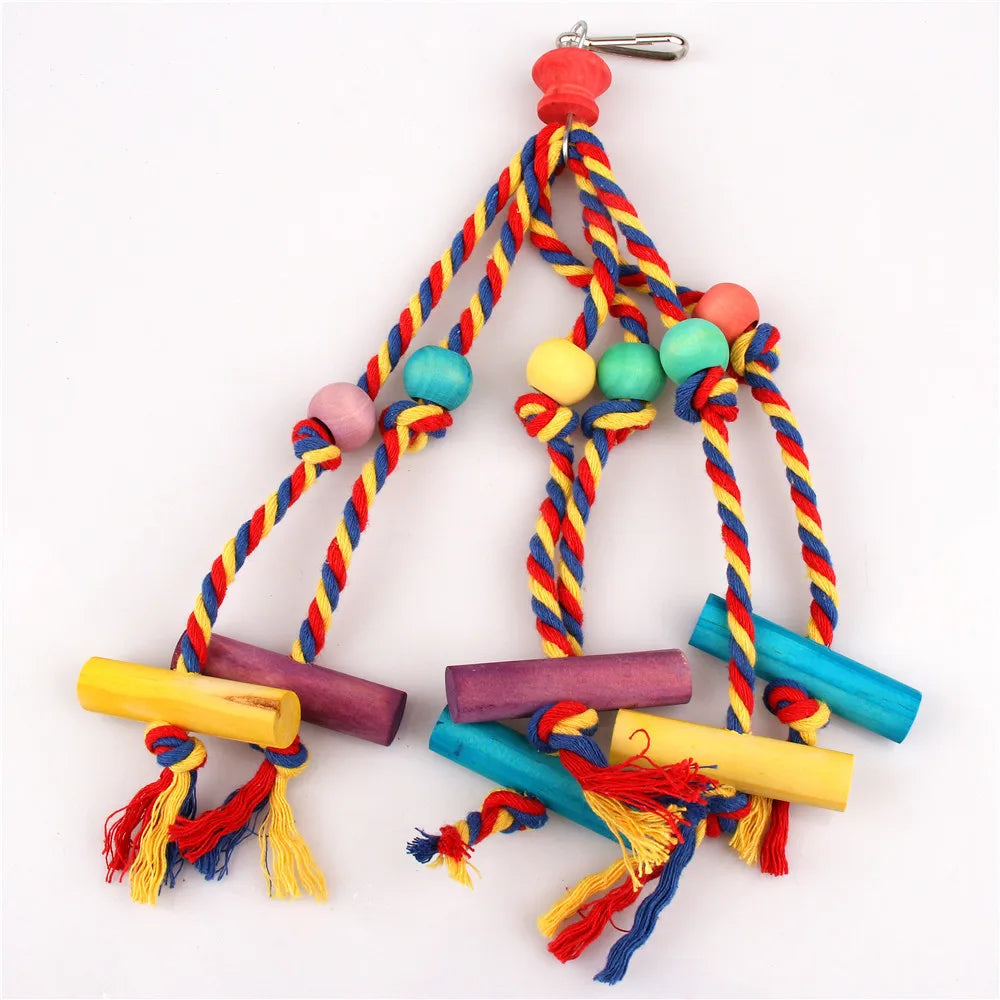 A colorful parrot chewing toy made of natural wood and cotton rope with various colored beads and tassels.
