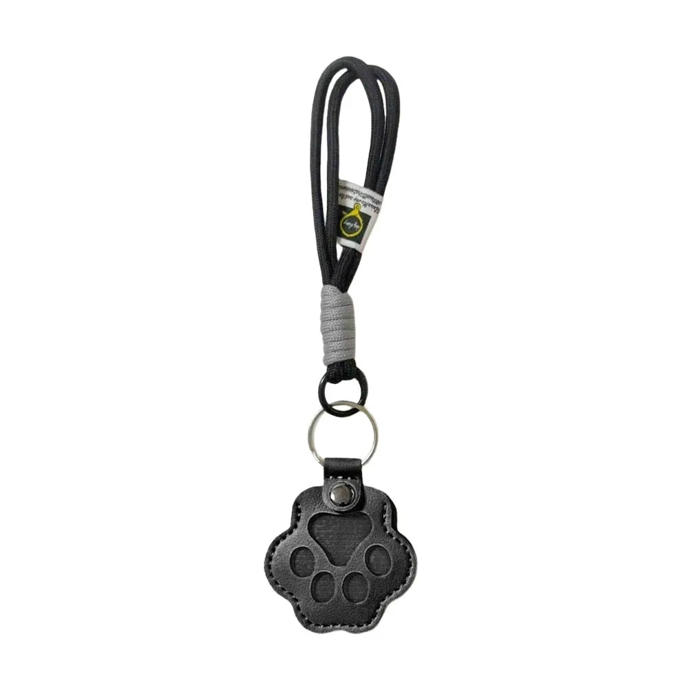 Black refillable pet hair keychain with a cat paw charm and lanyard