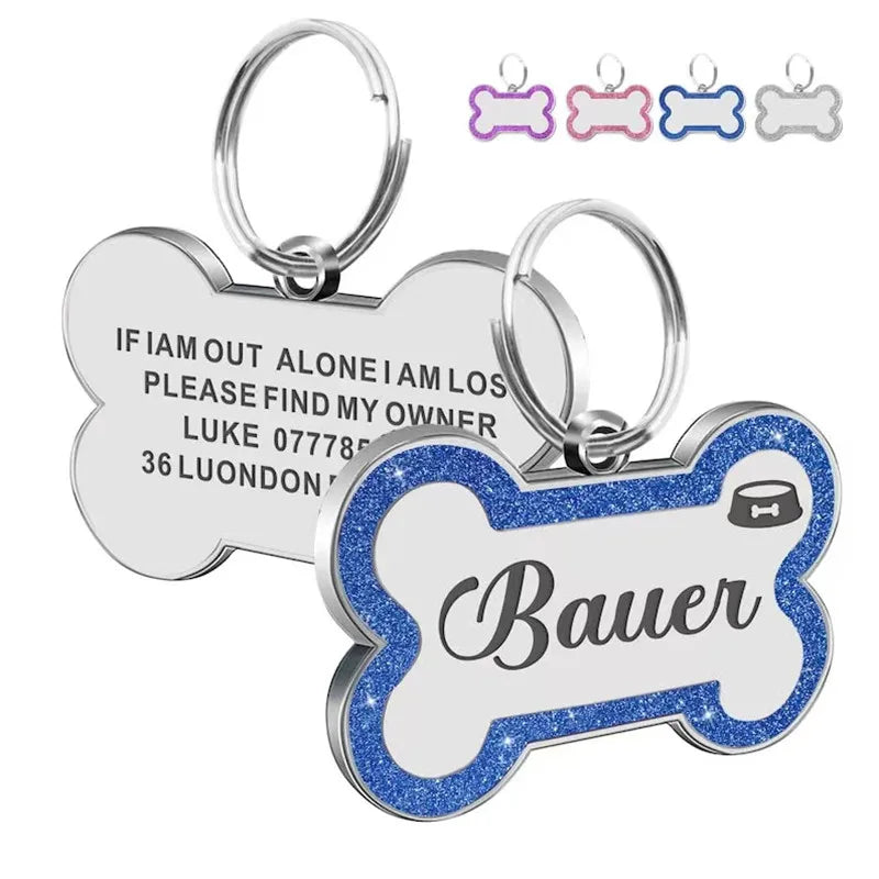 Silver and blue glitter pet ID tags featuring a paw print design with the name Bauer engraved.