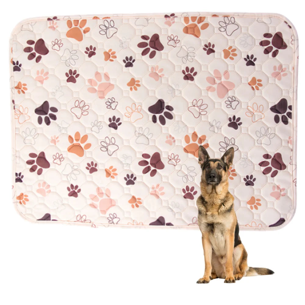 A German Shepherd dog sitting on a pink quilted dog training pad with paw prints.