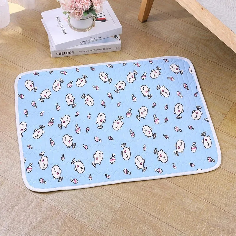 Light blue pet cooling mat featuring a pattern of cute fish and sea creatures