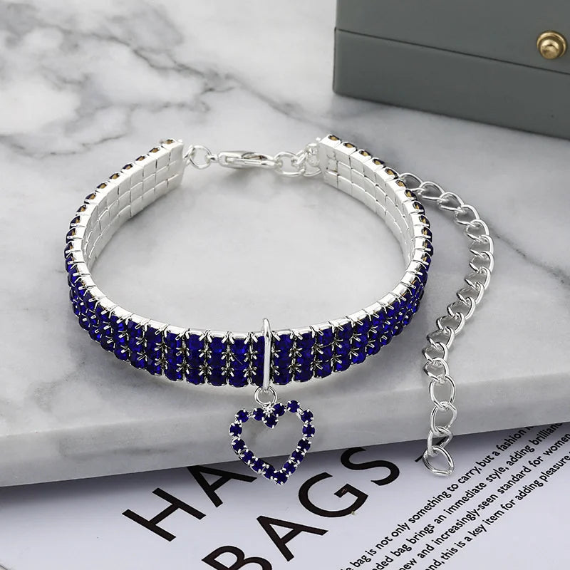 Silver collar with blue rhinestones and a heart pendant for dogs or cats