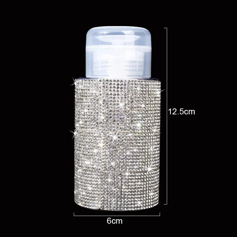A clear pump bottle filled with sparkling diamond-like glitter, used for nail polish remover or makeup.