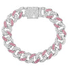A silver iced-out Cuban link bracelet featuring pink and clear rhinestones.
