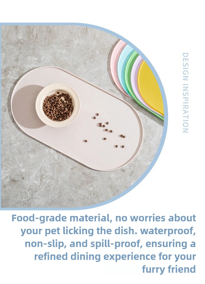 A pink feeding mat with a bowl of pet food on a gray surface, demonstrating a non-slip and spill-proof design.