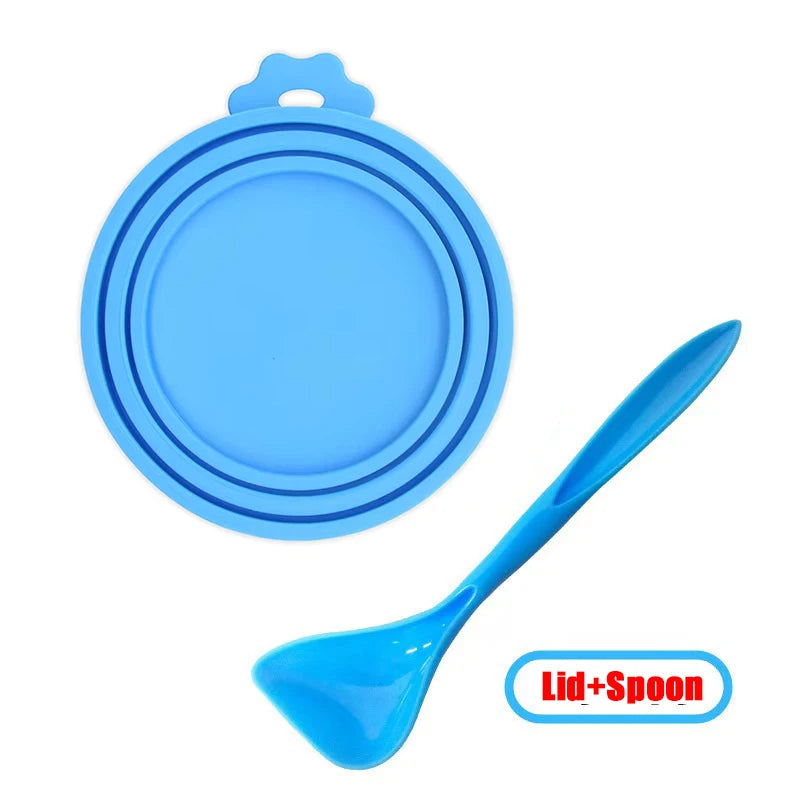 Blue reusable silicone pet food can lid with a matching spoon