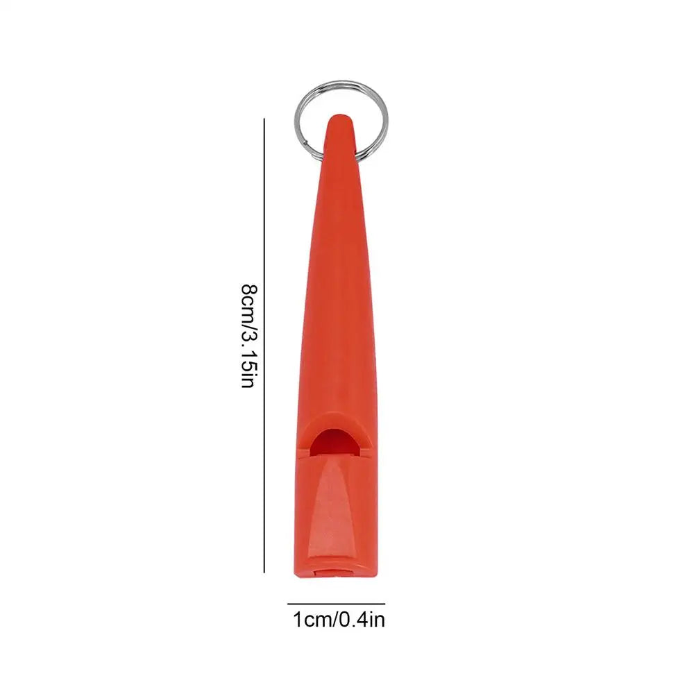 Sifflet de dressage pour chien compact orange avec boucle métallique et design pointu.