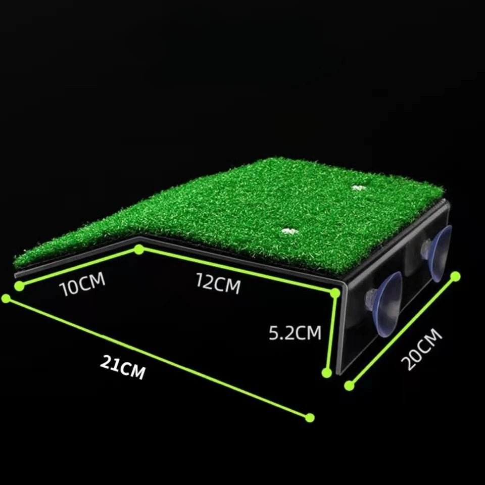 A black basking platform with a green grass ramp and suction cups, showing various dimensions.