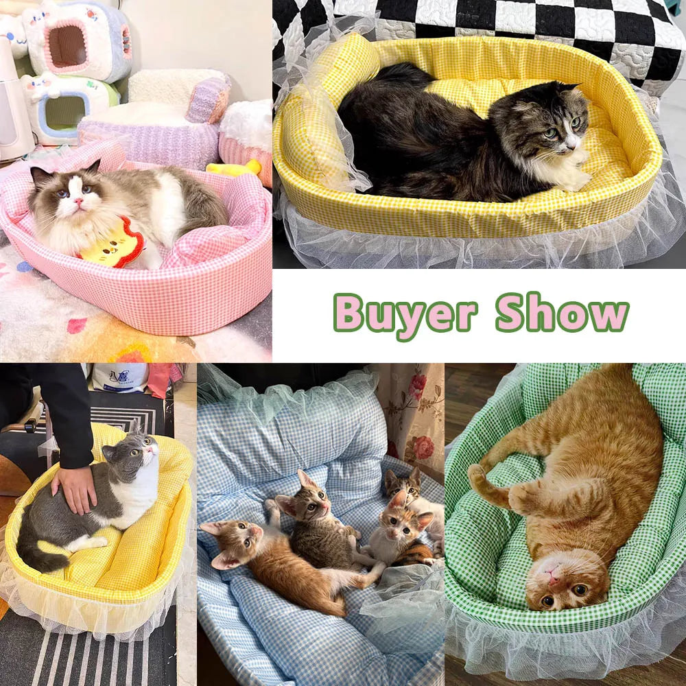 A yellow lace-trimmed plush pet sofa bed with a black cat and a ginger kitten inside.