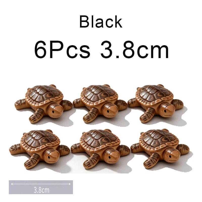 Six black turtle floating ornaments, each measuring 3.8cm.