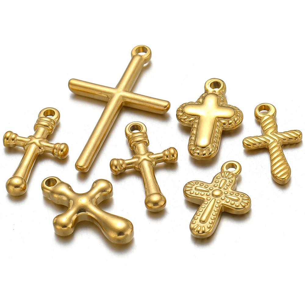 A set of vintage gold-colored cross charms for DIY jewelry making