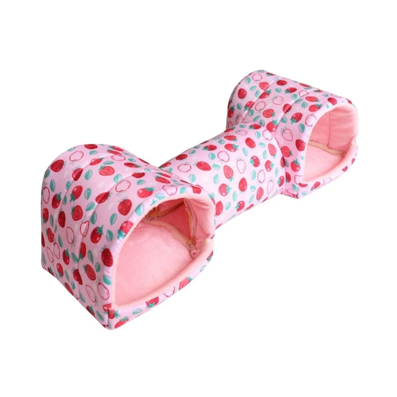A pink fleece tunnel bed with a strawberry pattern for small pets.