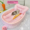 A pink lace-trimmed plush pet sofa bed with a gray kitten resting inside.