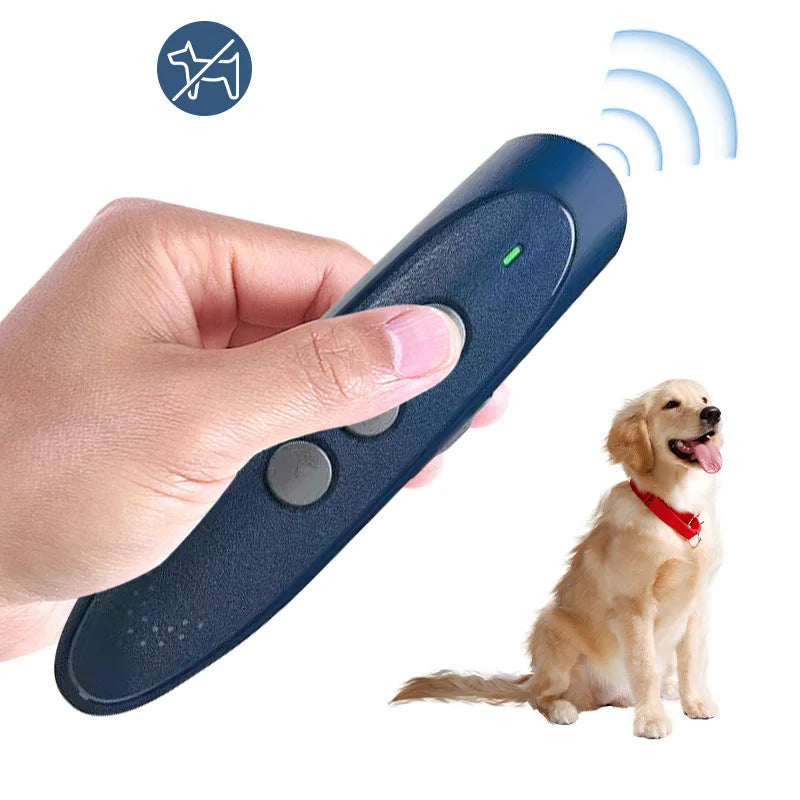 A hand holds an ultrasonic dog bark deterrent device with an LED indicator, aimed toward a dog.
