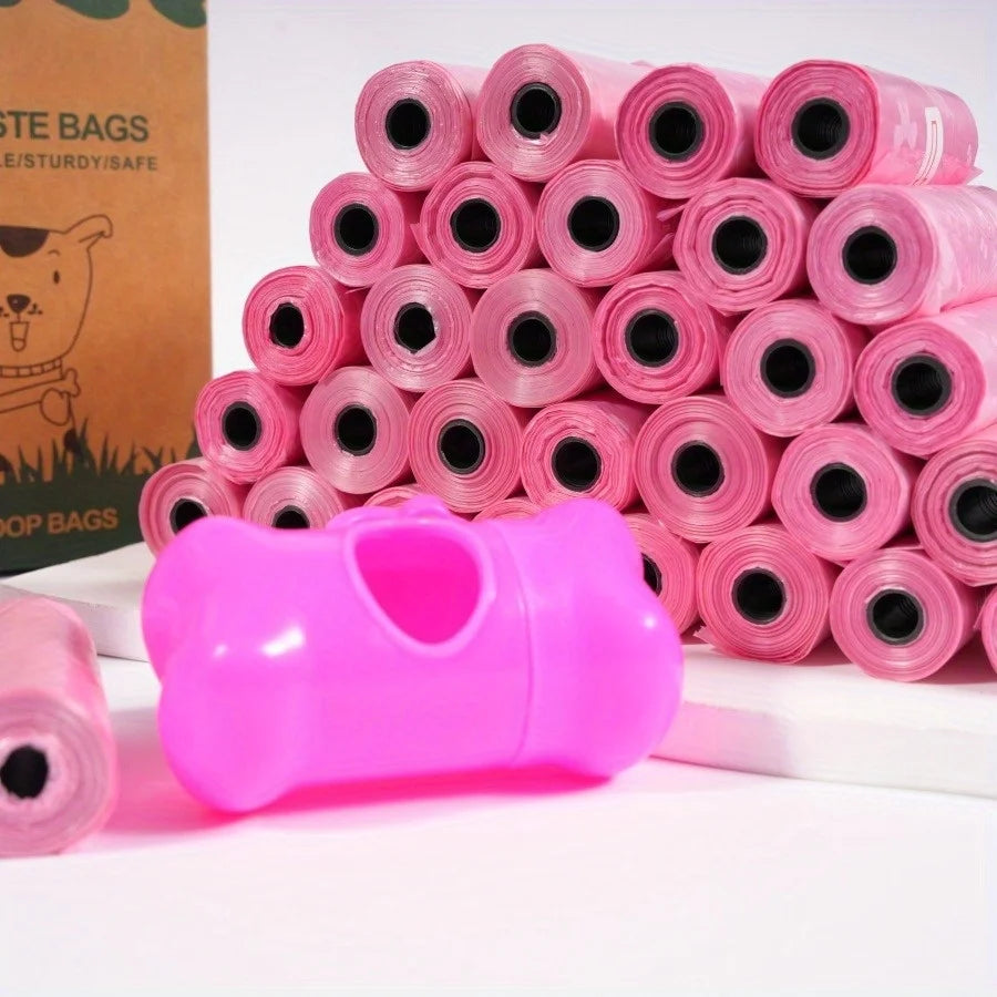 A stack of 20 pink puppy crown patterned scented dog waste bags in rolls next to a bright pink plastic container.