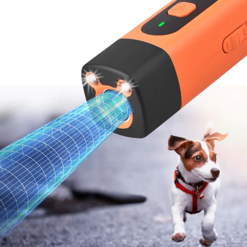 An orange ultrasonic dog repeller device is shown emitting a blue sound wave toward a dog.