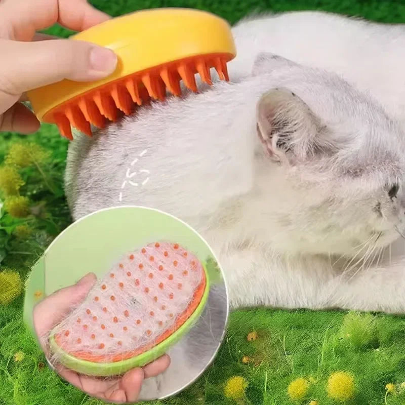 A hand holds a yellow silicone brush and a green brush, demonstrating a 3-in-1 electric steam brush for pets.