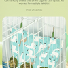 A light blue fabric bag with a white pattern is hung inside a wire cage, used as a space-saving hay feeder for rabbits.